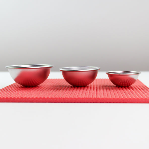 3 metal shaping cups on coral shaping mat