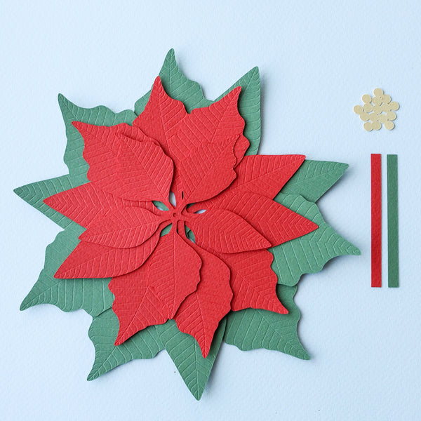 Cutout layers of red paper poinsettia SVG.
